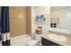 Cozy bathroom with a bathtub, tiled shower, granite countertops, and blue accents at 6552 Rhythm Dr, Mascotte, FL 34753