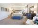 Comfortable and spacious main bedroom featuring neutral tones, plush carpeting, and elegant furnishings at 6552 Rhythm Dr, Mascotte, FL 34753