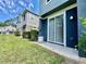 Back patio with gray paint and sliding glass doors leading to the home's interior at 6640 S Goldenrod Rd # 118B, Orlando, FL 32822