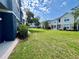 Well-maintained backyard with lush green grass and surrounding townhome buildings at 6640 S Goldenrod Rd # 118B, Orlando, FL 32822