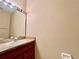 Bathroom featuring a single sink vanity with a large mirror and overhead lighting at 6640 S Goldenrod Rd # 118B, Orlando, FL 32822