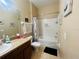 Bathroom with tile floors, shower over tub with vanity and decor at 6640 S Goldenrod Rd # 118B, Orlando, FL 32822
