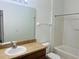 Clean bathroom with a tub/shower, vanity and large mirror at 6640 S Goldenrod Rd # 118B, Orlando, FL 32822
