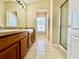 Bathroom with double sink vanity, tile flooring, and a separate shower stall at 6640 S Goldenrod Rd # 118B, Orlando, FL 32822
