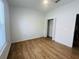 Image features an empty bedroom with wood-look floors, a window, ceiling fan and a closet at 6640 S Goldenrod Rd # 118B, Orlando, FL 32822