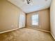 This cozy bedroom features a window, carpeting, and a double-door closet for storing personal belongings at 6640 S Goldenrod Rd # 118B, Orlando, FL 32822