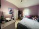 Bedroom with purple walls, carpet and a double closet provides comfort and storage at 6640 S Goldenrod Rd # 118B, Orlando, FL 32822