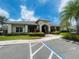 A community clubhouse with accessible parking and manicured landscaping at 6640 S Goldenrod Rd # 118B, Orlando, FL 32822