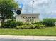 Elegant community sign with lush landscaping, creating a welcoming and attractive entrance to the neighborhood at 6640 S Goldenrod Rd # 118B, Orlando, FL 32822