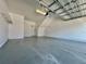 Spacious garage with epoxy flooring, storage shelves and an automatic door opener at 6640 S Goldenrod Rd # 118B, Orlando, FL 32822