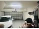 Garage has a white car, shelving, automatic garage door opener and storage containers at 6640 S Goldenrod Rd # 118B, Orlando, FL 32822