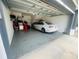 Garage featuring a car parked inside offering secure parking at 6640 S Goldenrod Rd # 118B, Orlando, FL 32822