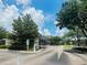 A secure Carter Glen entrance with gate and lush landscaping at 6640 S Goldenrod Rd # 118B, Orlando, FL 32822