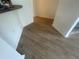 Neutral hallway featuring modern wood flooring and crisp white walls, creating a clean and bright transition space at 6640 S Goldenrod Rd # 118B, Orlando, FL 32822