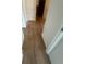 Bright hallway features modern wood flooring with neutral walls and white trim at 6640 S Goldenrod Rd # 118B, Orlando, FL 32822