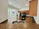 Kitchen featuring stainless steel appliances, a double sink with light brown countertops and view to the outside at 6640 S Goldenrod Rd # 118B, Orlando, FL 32822