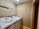 Laundry room featuring a washer and dryer, with wire shelving above for extra storage at 6640 S Goldenrod Rd # 118B, Orlando, FL 32822