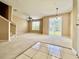 Bright living room features neutral carpet, ceiling fan, and sliding glass doors to the exterior at 6640 S Goldenrod Rd # 118B, Orlando, FL 32822