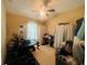 A multipurpose room with exercise equipment and storage is shown in this tan room at 6640 S Goldenrod Rd # 118B, Orlando, FL 32822