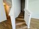 Attractive wood staircase leading to the upper level, seamlessly blending style with functionality at 6640 S Goldenrod Rd # 118B, Orlando, FL 32822