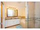 Bathroom featuring a large mirror, vanity with sink, a soaking tub and shower at 7691 Heritage Crossing Way # C-1, Reunion, FL 34747