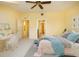 Bright bedroom with a desk area; well-lit and cozy, with modern decor and an inviting bed at 7691 Heritage Crossing Way # C-1, Reunion, FL 34747