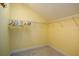 Walk-in closet features ample storage space with shelving and hanging rods, perfect for organization at 7691 Heritage Crossing Way # C-1, Reunion, FL 34747
