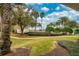 Beautiful community features lush landscaping, a pool, and picturesque walkways, creating an inviting outdoor space at 7691 Heritage Crossing Way # C-1, Reunion, FL 34747