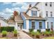 Charming two-story townhome featuring a landscaped front yard and inviting entrance during the day at 7691 Heritage Crossing Way # C-1, Reunion, FL 34747