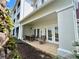 Inviting outdoor patio with comfortable seating, perfect for dining al fresco and enjoying the serene surroundings at 7691 Heritage Crossing Way # C-1, Reunion, FL 34747