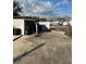 Spacious backyard features a concrete patio, lush green grass, and a secure fence at 803 N Pine Hills Rd, Orlando, FL 32808