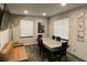 Modern dining room with a sleek concrete table, comfortable seating, and contemporary decor at 803 N Pine Hills Rd, Orlando, FL 32808