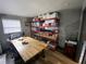 Functional office space with bright light, large desk, and storage shelving at 803 N Pine Hills Rd, Orlando, FL 32808