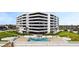 Modern condo building with swimming pool and green space for relaxation at 901 S Atlantic Ave # 5, Ormond Beach, FL 32176