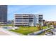 Modern condo building with swimming pool, lawn and parking at 901 S Atlantic Ave # 5, Ormond Beach, FL 32176