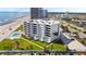 Coastal condo building with a private pool, lawns, and parking at 901 S Atlantic Ave # 5, Ormond Beach, FL 32176
