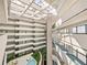 The atrium features multiple levels and a water feature surrounded by lush greenery at 901 S Atlantic Ave # 5, Ormond Beach, FL 32176