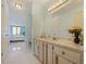Bathroom with tile flooring, marble countertop, and a view to the adjacent room at 901 S Atlantic Ave # 5, Ormond Beach, FL 32176
