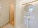 Modern bathroom with glass-enclosed shower, white tile, and a pedestal sink at 901 S Atlantic Ave # 5, Ormond Beach, FL 32176