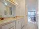 Bright bathroom with white cabinets, marble countertops, and tile flooring at 901 S Atlantic Ave # 5, Ormond Beach, FL 32176