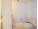 A clean bathroom features a toilet, vanity with marble countertop, and marble floors at 901 S Atlantic Ave # 5, Ormond Beach, FL 32176
