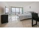 Inviting bedroom with ocean view balcony, modern furniture, and plenty of natural light at 901 S Atlantic Ave # 5, Ormond Beach, FL 32176