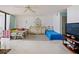 Spacious bedroom featuring tile floors, balcony access, and plenty of space for multiple beds at 901 S Atlantic Ave # 5, Ormond Beach, FL 32176