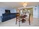 The living room, dining room, and kitchen provide an open concept area for living at 901 S Atlantic Ave # 5, Ormond Beach, FL 32176