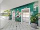 The lobby features stylish emerald herringbone tiles and modern elevator access at 901 S Atlantic Ave # 5, Ormond Beach, FL 32176