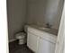 Modern half-bathroom featuring a quartz countertop and wood-look tile flooring at 9338 Bolshoi Aly, Winter Garden, FL 34787
