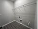 Practical laundry area featuring tile flooring and overhead shelving at 9338 Bolshoi Aly, Winter Garden, FL 34787