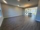 Open living room with tile flooring, recessed lighting, flowing into an open kitchen at 9338 Bolshoi Aly, Winter Garden, FL 34787