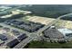 Aerial view showcasing the community layout, surrounding greenery, and roadways at 9356 Bolshoi Aly, Winter Garden, FL 34787