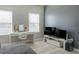 Bedroom featuring a white desk area with natural light from the nearby bright windows at 9575 Silver Buttonwood St, Orlando, FL 32832